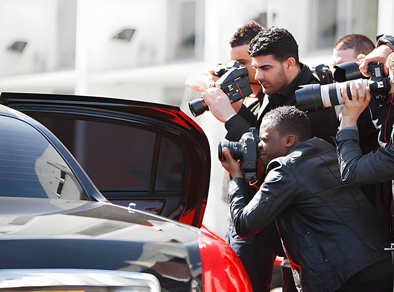An image featuring a step-by-step guide to celebrity photography, showcasing a photographer setting up equipment and interacting with a celebrity subject.